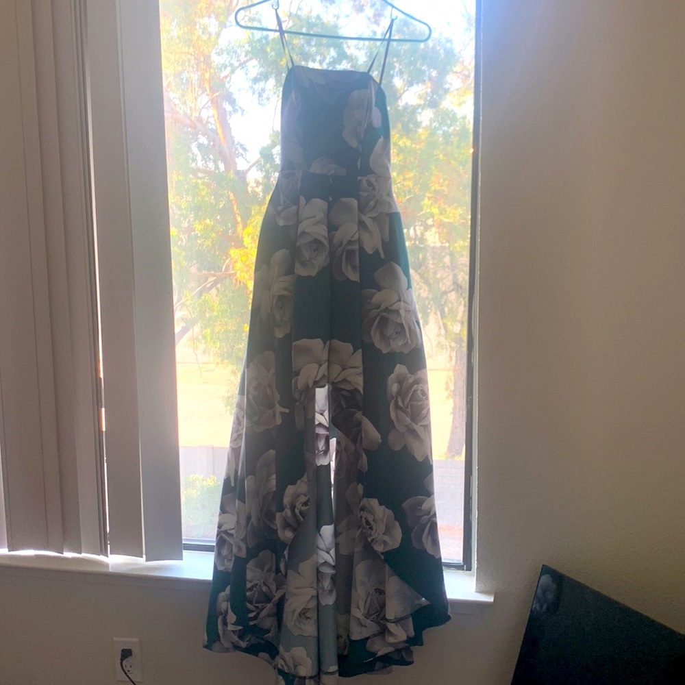 Emerald green prom dress with white roses